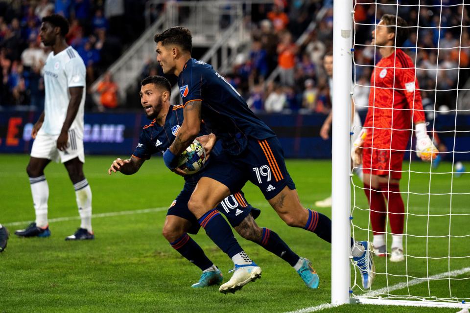 FC Cincinnati midfielder Luciano Acosta (10) grabs FC Cincinnati forward Brandon Vazquez (19) after scoring a goal in the second half of the MLS match at TQL Stadium in Cincinnati on Saturday, Oct. 1, 2022. Chicago Fire defeated FC Cincinnati 3-2.