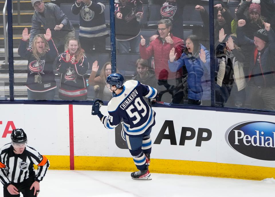 Fans celebrate a goal by Columbus Blue Jackets right wing Yegor Chinakhov (59) during the shootout in the NHL hockey game against the Minnesota Wild at Nationwide Arena in Columbus on March 11, 2022. The Blue Jackets won 3-2 in a shootout.