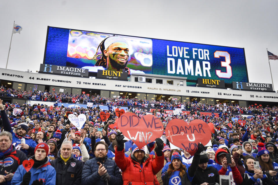 FILE - Fans stand in support for Buffalo Bills safety Damar Hamlin (3) before an NFL football game against the New England Patriots, Sunday, Jan. 8, 2023, in Orchard Park, N.Y. Damar Hamlin plans to support young people through education and sports with the $8.6 million in GoFundMe donations that unexpectedly poured into his toy drive fundraiser after he suffered a cardiac arrest in the middle of a game last week. (AP Photo/Adrian Kraus, File)