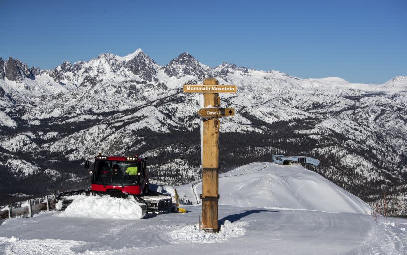 MAMMOTH LAKES, CA - October 27 2021: A snow plow sculpts a ridge atop the summit at 11,053 ft. on Mammoth Mountain on Wednesday, Oct. 27, 2021 in Mammoth Lakes, CA. The ski resort will open two weeks earlier than scheduled thanks to recent snow storms. (Brian van der Brug / Los Angeles Times)