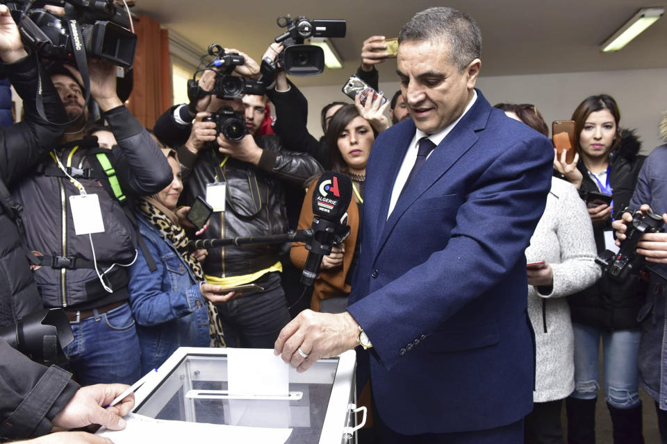 Presidential candidate Abdelaziz Belaid casts his ballot inside a polling station, in Algiers, Algeria, Thursday, Dec. 12, 2019. Five candidates have their eyes on becoming the next president of Algeria - without a leader since April - in Thursday's contentious election boycotted by a massive pro-democracy movement. (AP Photo)
