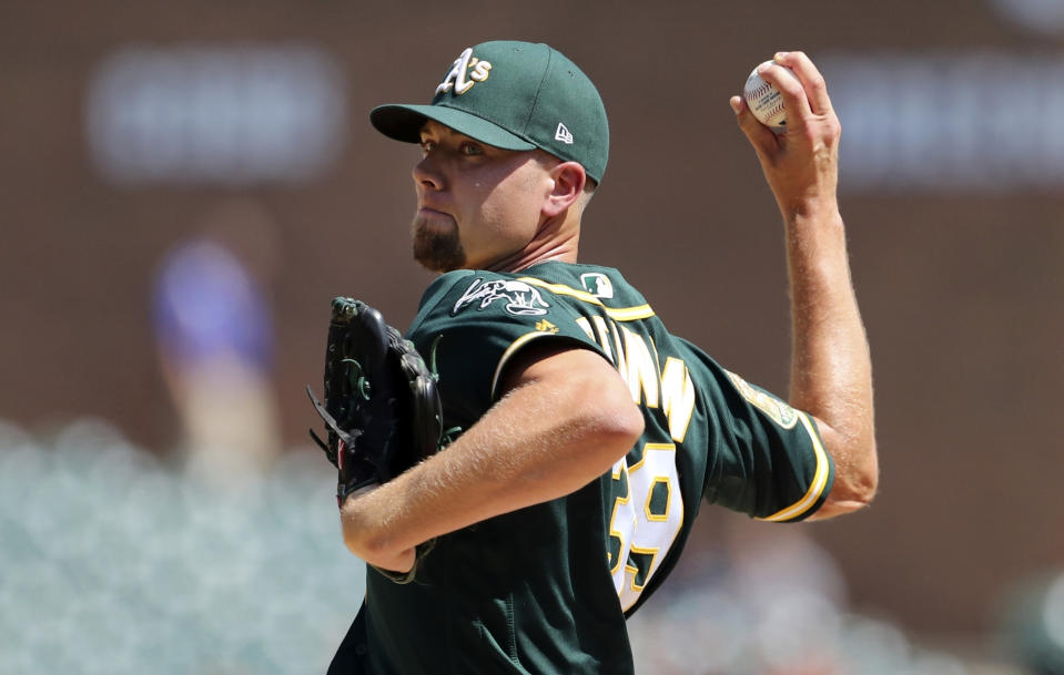 FILE - In this June 28, 2018, file photo, Oakland Athletics relief pitcher Blake Treinen throws during the ninth inning of a baseball game against the Detroit Tigers in Detroit. Treinen's case was heard Friday, Feb. 1, 2019, asking arbitrators for a raise from $2.2 million to $6.4 million and was offered $5.6 million. (AP Photo/Carlos Osorio, File)