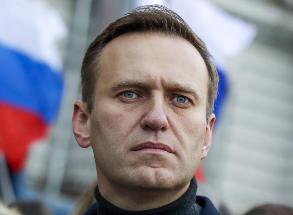FILE - In this Saturday, Feb. 29, 2020 file photo, Russian opposition activist Alexei Navalny takes part in a march in memory of opposition leader Boris Nemtsov in Moscow, Russia. The German government says specialist labs in France and Sweden have confirmed Russian opposition leader Alexei Navalny was poisoned with the Soviet-era nerve agent Novichok. (AP Photo/Pavel Golovkin, File)
