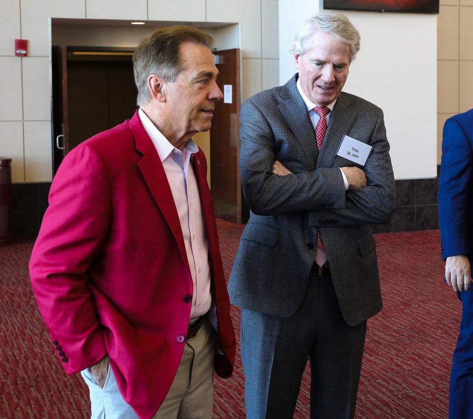 Jan 13, 2024; Tuscaloosa, AL, USA; The University of Alabama introduced new head football coach Kalen DeBoer with a press conference at Bryant-Denny Stadium. Retired head coach Nick Saban speaks with University of Alabama System Chancellor Finis St. John.