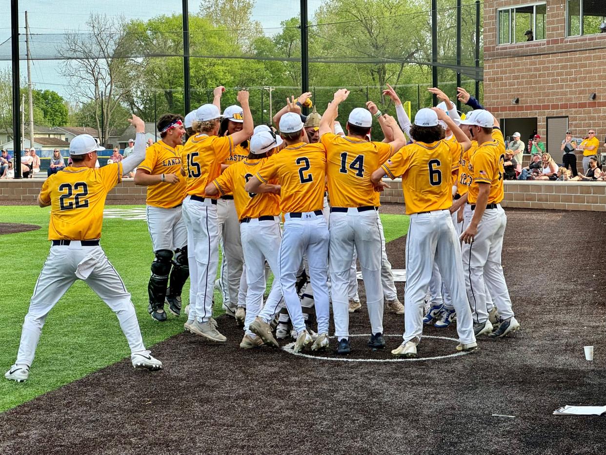 Lancaster baseball players celebrate after scoring the first run of the game in the second inning during Wednesday's 3-0 Ohio Capital Conference-Buckeye Division win over visiting Pickerington Central. The Gales forged a tie for first place in the league with the Tigers.