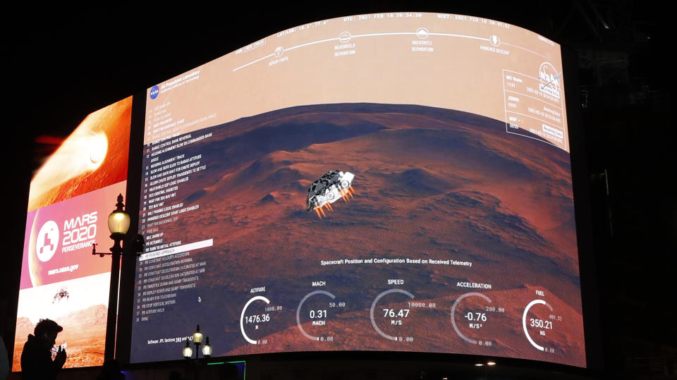 Images from NASA seen streamed live showing the landing of Perseverance on Mars, on Piccadilly Lights in central London. Source: AP

