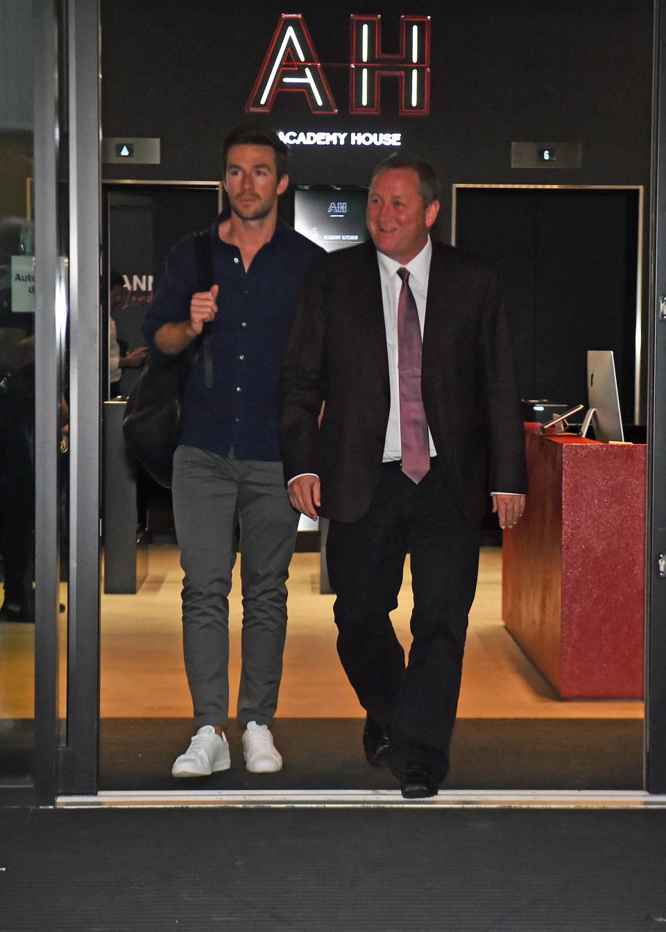 Mike Ashley leaves the Sports Direct headquarters in London with his future son-in-law, Michael Murray (left) (Kirsty O’Connor/PA) (PA Archive)