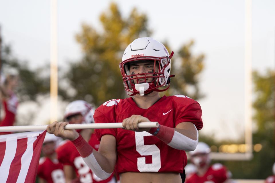 Beechwood senior Landon Aylor enters the field prior to a KHSAA high school football game against the Simon Kenton Pioneers at Beechwood High School Friday, Sept. 9, 2022, in Fort Mitchell, Ky.