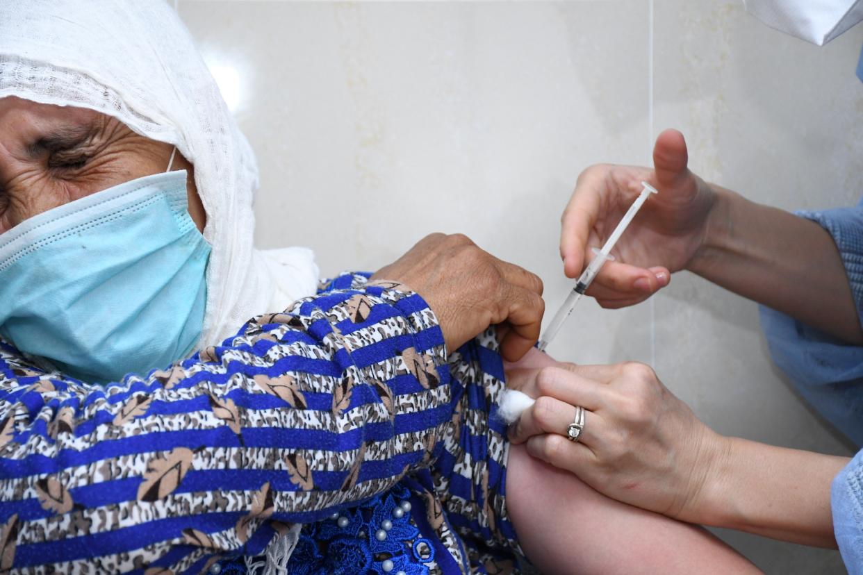 A woman receives a dose of the COVID-19 vaccine in Sale, Morocco, on June 16, 2021. Morocco's COVID-19 tally rose to 524,975 on Wednesday as 500 new cases were registered during the past 24 hours. Meanwhile, 9,369,489 people have received so far the first vaccine shot against COVID-19 in the country, and 7,683,878 people have received the second dose. (Photo by Chadi/Xinhua via Getty Images)