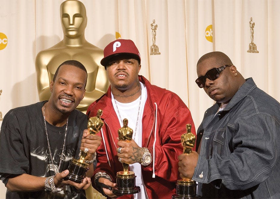 From left: Jordan Houston (Juicy J), Paul Beauregard (DJ Paul) and Cedric Coleman (Frayser Boy) posed backstage during the 78th Academy Awards on March 5, 2006, in the Kodak Theatre in Hollywood after they won the Oscar for Original Song.