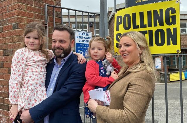 SDLP leader Colum Eastwood arrives to cast their vote in the 2022 NI Assembly election with his wife Rachael and children, Rosa, six, and Maya, four, in the Foyle constituency in Londonderry (Dominic McGrath/PA) (PA Wire)