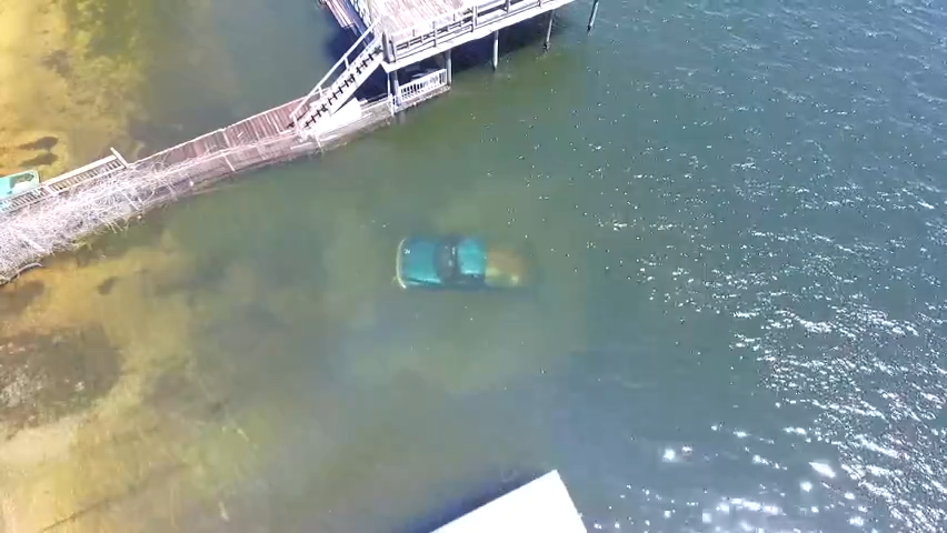 A drone image taken April 3, 2016, of the Florida Highway Patrol retrieving a Dodge pickup truck from Compass Lake in Jackson County. The bodies of Tarina White, 46, and Billy Pullam, 60, both of Alford, were found inside.