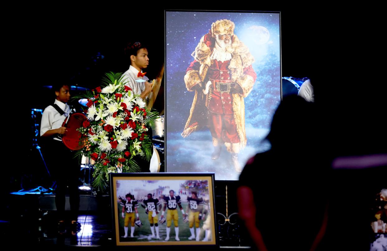 People attend a remembrance ceremony for Dr. Kenneth Wayne Blair, Sr., known as Santa Blair, at Life Church in Edmond, Okla. Saturday, April 6, 2024.