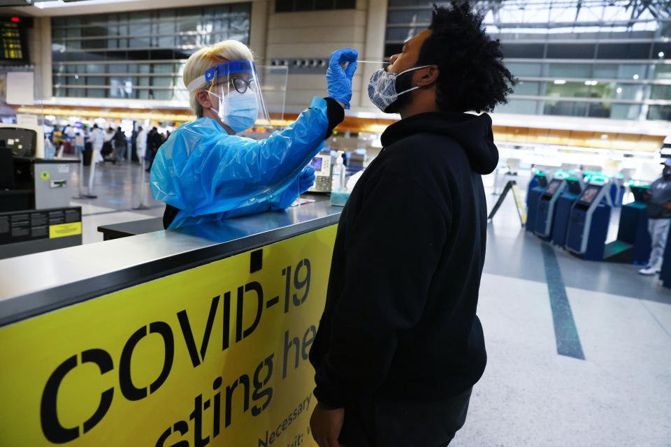 A man receives a nasal swab COVID-19 test at Tom Bradley International Terminal at Los Angeles International Airport (LAX) amid a coronavirus surge in Southern California on December 22, 2020 in Los Angeles, California. (Mario Tama/Getty Images)