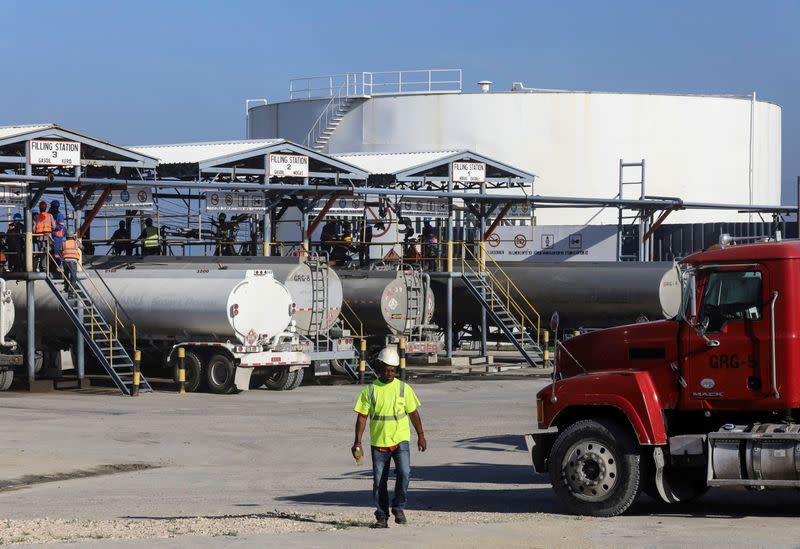 FILE PHOTO: Tanker trucks are being filled with fuel at the Varreux fuel terminal for distribution, in Port-au-Prince