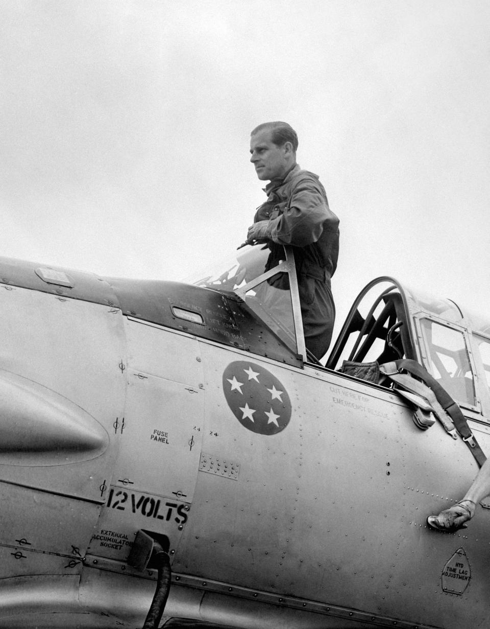 Prince Philip, the Duke of Edinburgh in the cockpit of a plane at White Waltham airfield in Berkshire today, when he made his last three flights before qualifying for his Royal Air Force wings.
