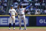 Los Angeles Dodgers' David Peralta stands on second base after reaching on a fielding error with Seattle Mariners second baseman Josh Rojas behind during the first inning of a baseball game, Sunday, Sept. 17, 2023, in Seattle. (AP Photo/John Froschauer)
