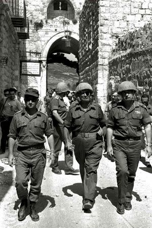 Retired General Uzi Narkiss (L) is seen in this file photo, taken in June 1967 at the end of the "Six Day War", entering Jerusalem's Old City via the Lion's Gate with then Defense Minister Moshe Dayan (C) and then Chief of Staff Yitzhak Rabin (R). REUTERS/GPO/Ilan Bruner/Handout via Reuters