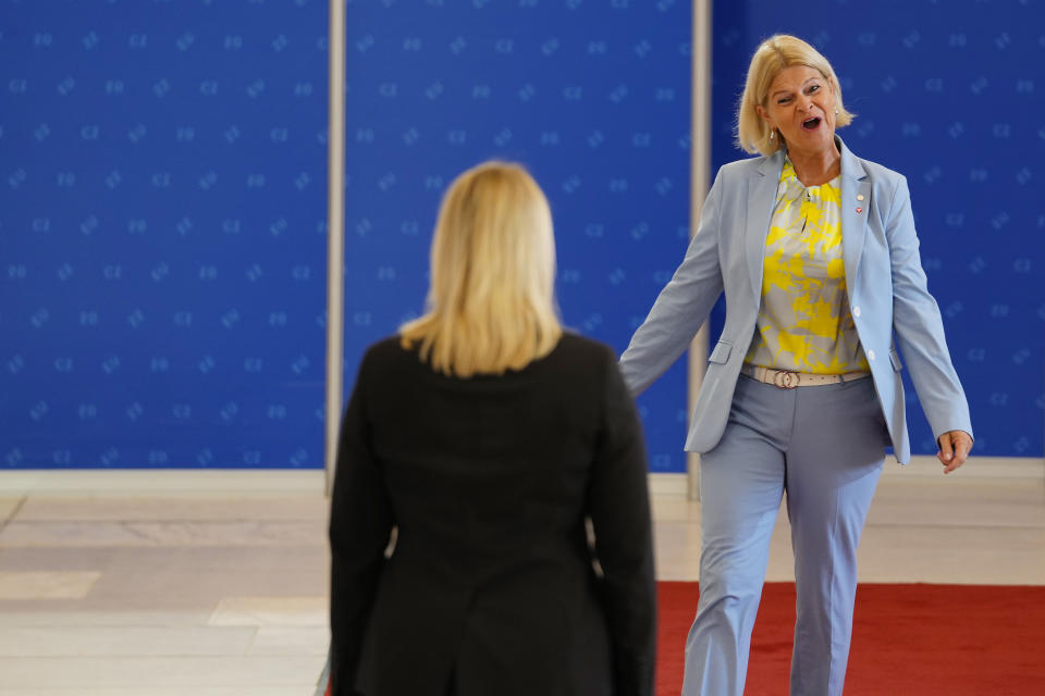 Austria's Defense Minister Klaudia Tanner, right, arrives for a meeting of EU Defense Ministers at the Prague Congress Center in Prague, Czech Republic, Tuesday, Aug. 30, 2022. (AP Photo/Petr David Josek)