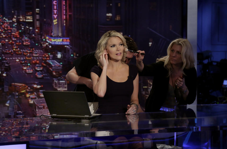 Megyn Kelly, host of Fox News Channel's "The Kelly Files," gets a make-up touch-up during rehearsals for the debut of her new prime-time show, in New York, Friday, Oct. 4, 2013. Her program is the linchpin to the first overhaul of Fox's prime-time lineup since 2002, or about a century in television time. (AP Photo/Richard Drew)