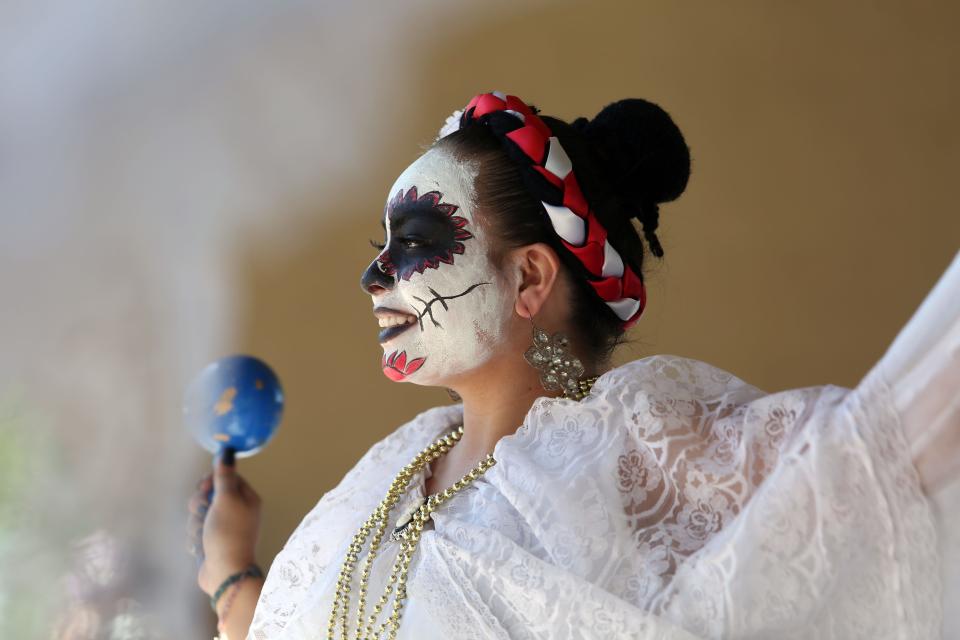 Folklorico dancers from Cathedral City High School perform at Cathedral City's annual Dia de los Muertos celebration at Desert Memorial Park cemetery on Saturday, October 27, 2018.