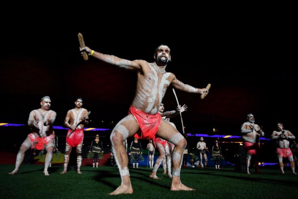 Indigenous dancers perform during the opening match of the round between the Storm and Manly at AAMI Park in Melbourne.