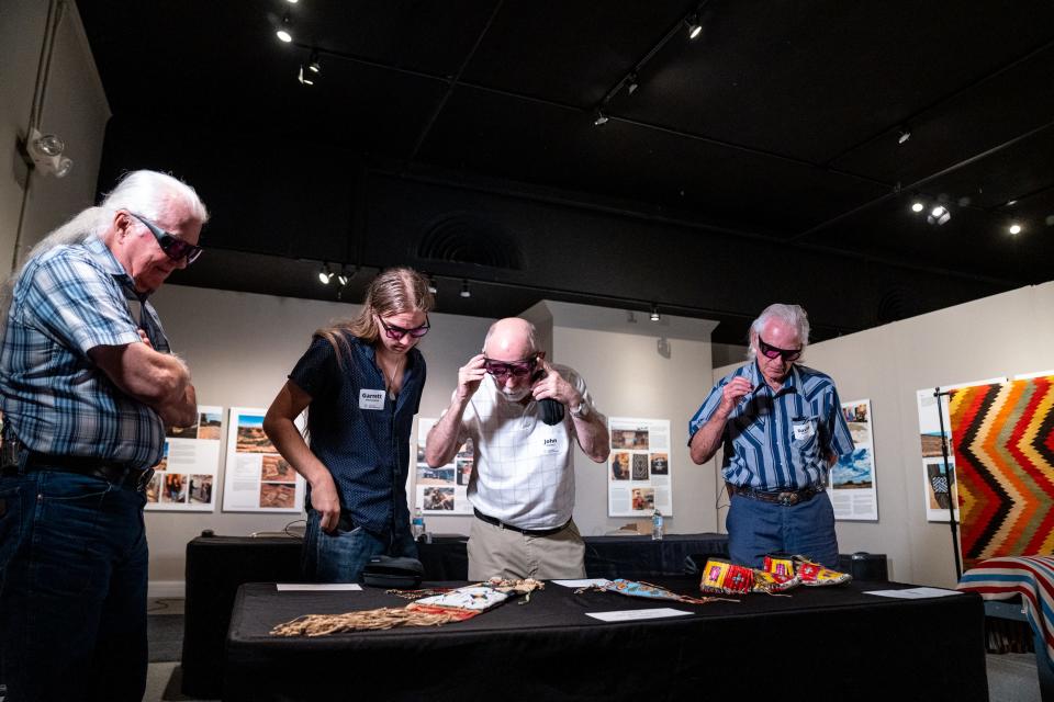 Ray St. Clair (left), Garrett Hoskinson, John Turner and David Eerkes wear EnChroma color-blind glasses during a demonstration of the technology at the Arizona State Museum located at the University of Arizona in Tucson on Sept. 19, 2023.
