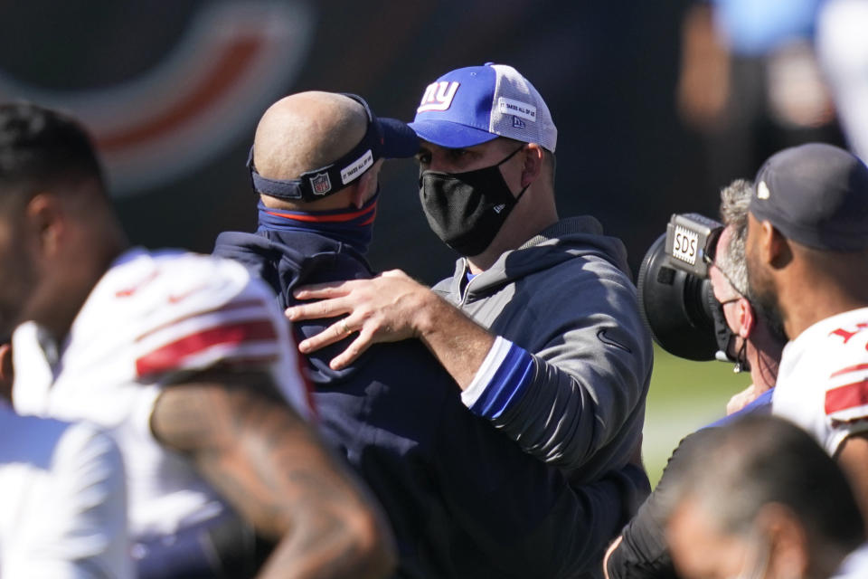 Chicago Bears head coach Matt Nagy and New York Giants head coach Joe Judge talk after an NFL football game in Chicago, Sunday, Sept. 20, 2020. Chicago won 17-13. (AP Photo/Charles Rex Arbogast)