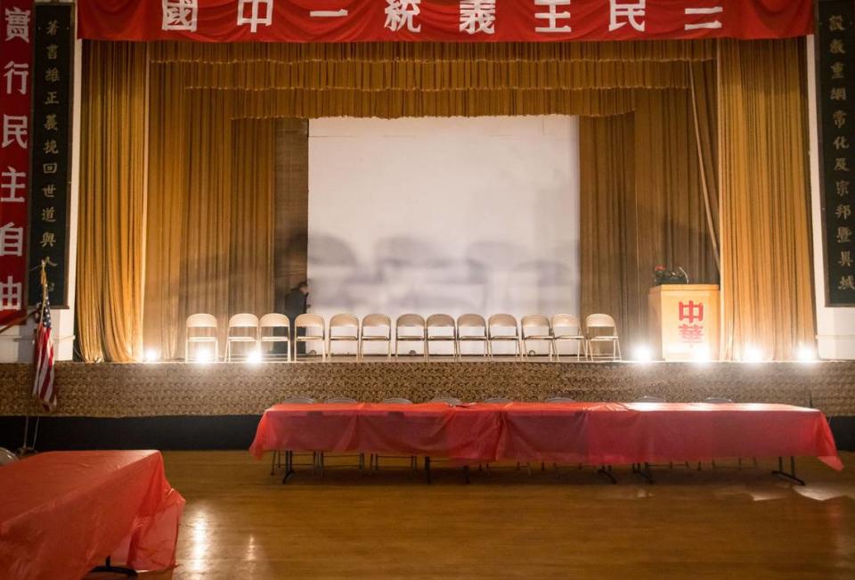 Empty chairs stand on the auditorium stage inside the Confucius Temple, operated by the Chinese Consolidated Benevolent Association, earlier this month. The church as been idle since the coronavirus pandemic.