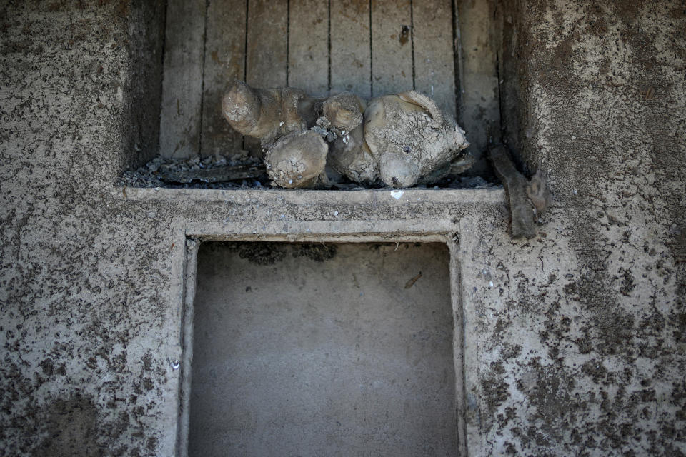 A mud encrusted teddy bear sits in a formerly sunken boat at the Lake Mead National Recreation Area, Wednesday, June 22, 2022, near Boulder City, Nev. (AP Photo/John Locher)