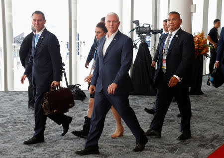 U.S. Vice President Mike Pence reacts as he walks past China's President Xi Jinping (not pictured) while leaving APEC Haus, during the APEC Summit in Port Moresby, Papua New Guinea November 18, 2018. REUTERS/David Gray