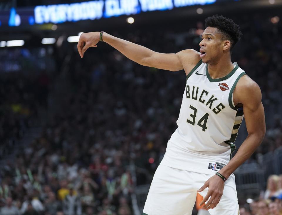 Milwaukee Bucks' Giannis Antetokounmpo watches a shot during the first half of Game 5 of the NBA Eastern Conference basketball playoff finals against the Toronto Raptors Thursday, May 23, 2019, in Milwaukee. (AP Photo/Morry Gash)