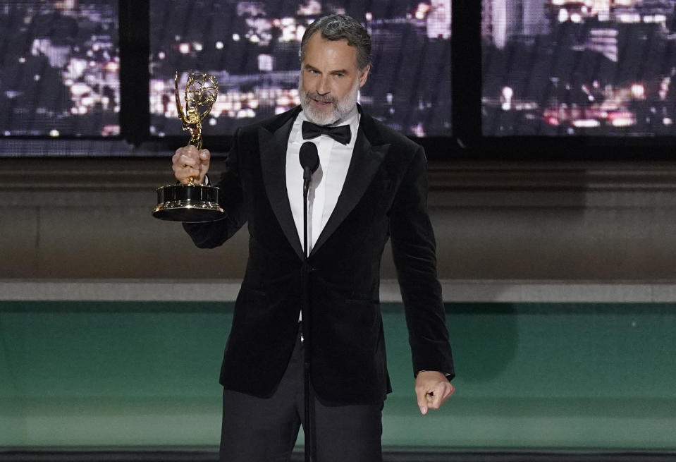 Murray Bartlett accepts the emmy for for outstanding supporting actor in a limited anthology series or movie for "The White Lotus" at the 74th Primetime Emmy Awards on Monday, Sept. 12, 2022, at the Microsoft Theater in Los Angeles. (AP Photo/Mark Terrill)