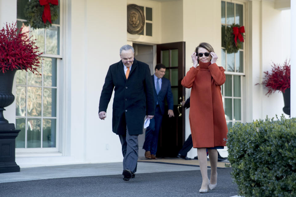 House Minority Leader Nancy Pelosi of Calif., right, and Senate Minority Leader Sen. Chuck Schumer of N.Y., left, walk out of the West Wing to speak to members of the media outside of the White House in Washington, Tuesday, Dec. 11, 2018, following a meeting with President Donald Trump. (AP Photo/Andrew Harnik)