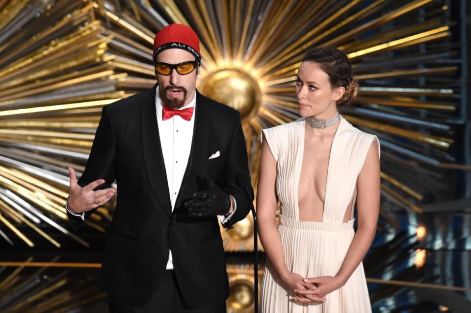 <div class="inline-image__caption"><p>Sacha Baron Cohen (as Ali G) and Olivia Wilde speak onstage during the 88th Annual Academy Awards at the Dolby Theatre on February 28, 2016, in Hollywood, California. </p></div> <div class="inline-image__credit">Kevin Winter/Getty</div>