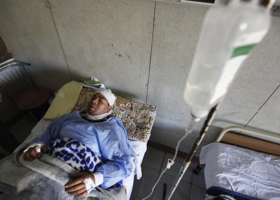 An injured man recuperates in hospital after an explosion at a security building in Egypt's Nile Delta city of Mansoura