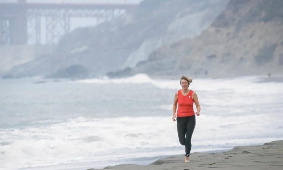 Joan Ullyot running on the beach near her home in San Francisco, California, in 1985.