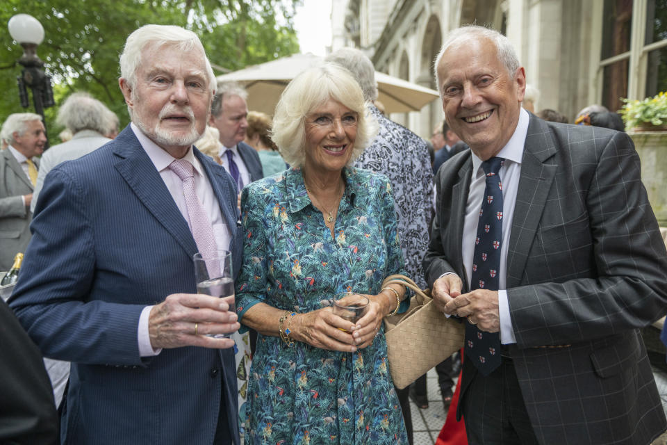 LONDON, ENGLAND- JULY 12: Camilla, Duchess of Cornwall with Derek Jacobi (L) and Gyles Brandreth (R) as the Duchess celebrates her 75th birthday at a lunch, hosted by the Oldie Magazine at the National Liberal Club on July 12, 2022 in London, England. The lunch organized by Gyles Brandreth and the Oldie was arranged to celebrate the Duchess's birthday but also celebrates people over the age of 75 who are continuing to serve. The theme is 
