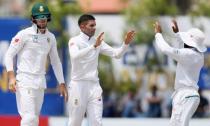 Cricket - Sri Lanka v South Africa - First Test Match - Galle, Sri Lanka - July 14, 2018 - South Africa's Keshav Maharaj (C) celebrates with teammates Temba Bavuma (R) and Aiden Markram after taking the wicket of Sri Lanka's Angelo Mathews (not pictured). REUTERS/Dinuka Liyanawatte