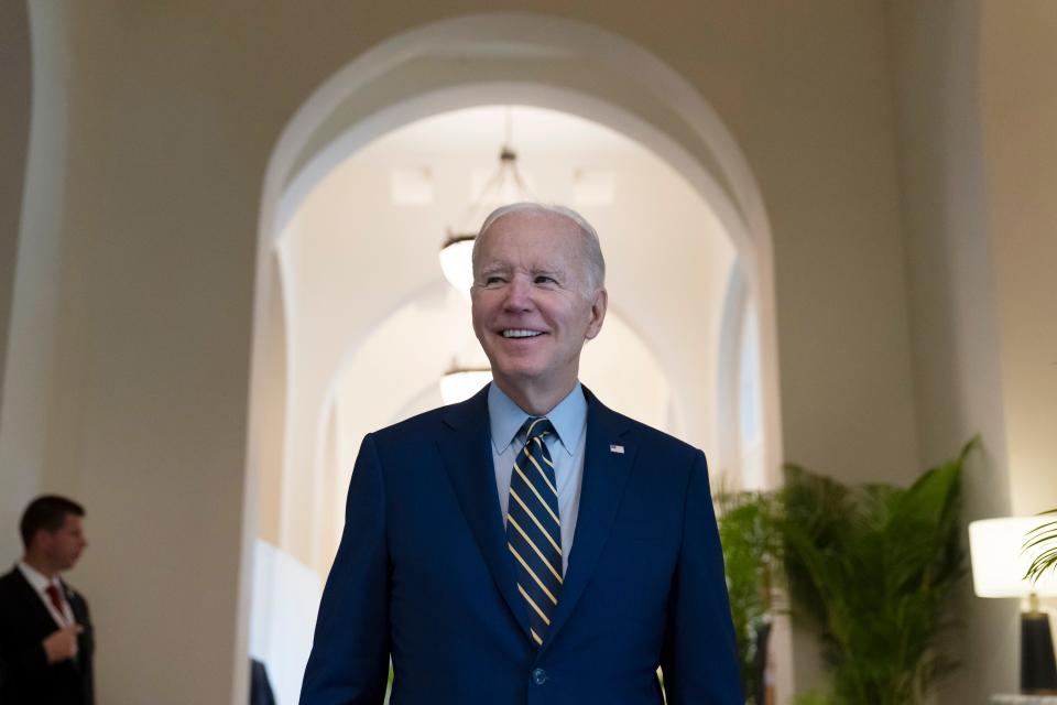 President Joe Biden smiles as he speaks about Democratic control of the Senate before leaving his hotel to attend the Association of Southeast Asian Nations (ASEAN) summit, Sunday, Nov. 13, 2022, in Phnom Penh, Cambodia.