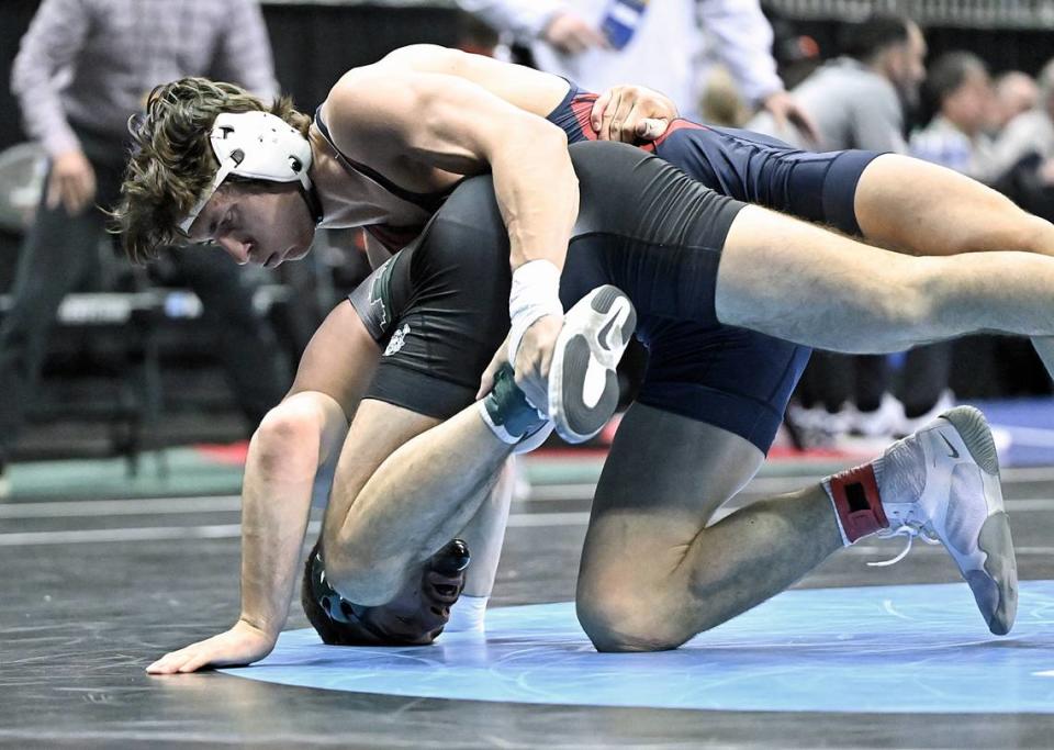 Penn’s Cole Urbas, who is a State College graduate, controls Cleveland State’s Benjamin Smith in their 197 pound consolation first round match of the NCAA Championships on Thursday, March 21, 2024 at T-Mobile Center in Kansas City, Mo. Urbas earned a 12-3 win over Smith.