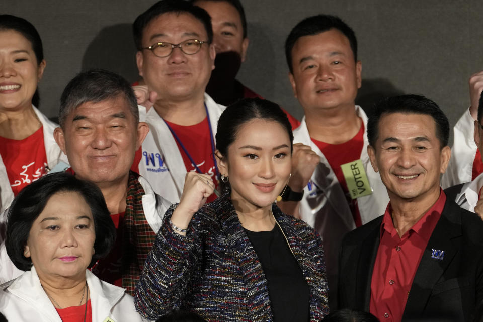 The daughter of Thailand's former Prime Minister Thaksin Shinawatra, Paetongtarn Shinawatra cheers with supporters during a Pheu Thai party general assembly meeting in Bangkok, Thailand, Tuesday, Dec. 6, 2022. Shinawatra promised a new era of social equality Tuesday, saying if her party is elected to power in next year's election it will bring an end to poverty in the Southeast Asian nation. (AP Photo/Sakchai Lalit)