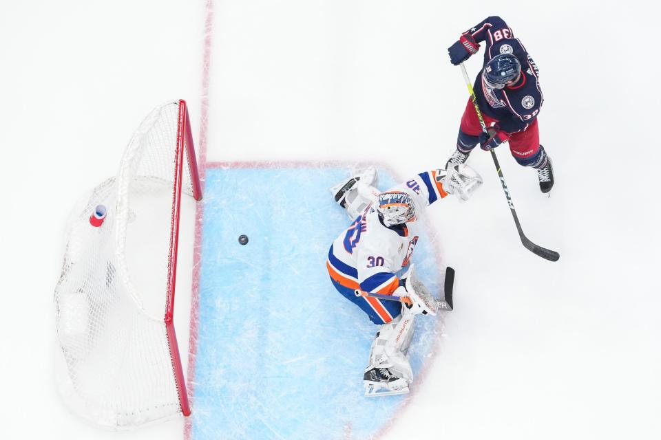 Mar 24, 2023; Columbus, Ohio, USA;  Columbus Blue Jackets center Boone Jenner (38) deflects the game-winning goal past New York Islanders goaltender Ilya Sorokin (30) during overtime of the NHL hockey game at Nationwide Arena. The Blue Jackets won 5-4. Mandatory Credit: Adam Cairns-The Columbus Dispatch