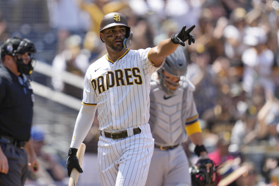 San Diego Padres' Xander Bogaerts reacts after scoring off an RBI-single by Jake Cronenworth during the first inning of a baseball game against the Milwaukee Brewers, Saturday, April 15, 2023, in San Diego. (AP Photo/Gregory Bull)