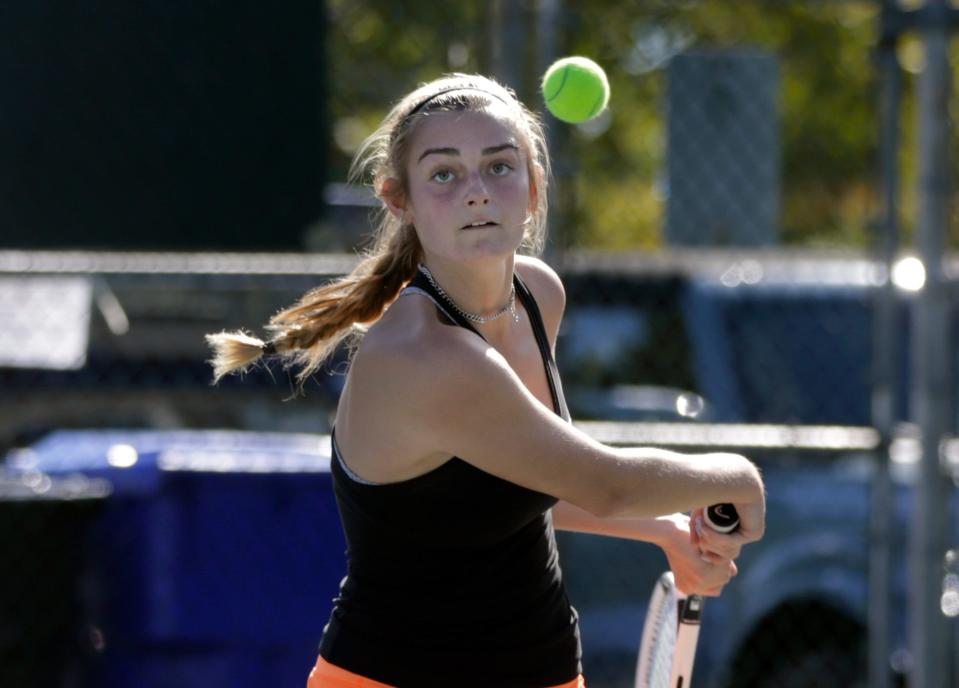 East Greenwich's Maddie Omicioli watches the incoming ball as she prepares her backhand for a return during her singles championship match Sunday.  Erin McCusker of LaSalle Academy beat East Greenwich's Maddie Omicioli  Sunday as the two faced off in the girls singles tennis final on Oct 17, 2021 at Slater Park in Pawtucket.   [The Providence Journal / Kris Craig]   ORG XMIT: 10042199A