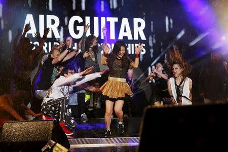 Nanami 'Seven Seas' Nagura from Japan celebrates during the Air Guitar World Championships final in Oulu, Finland, August 24, 2018. Lehtikuva/Eeva Riihela/via REUTERS