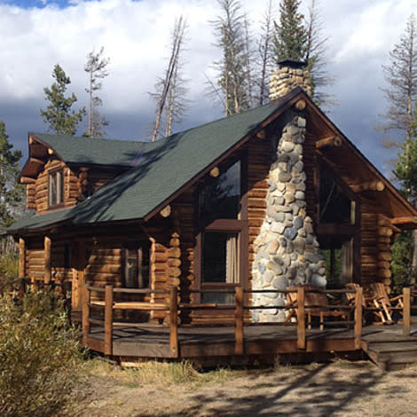 Classic log cabins with stone fireplaces