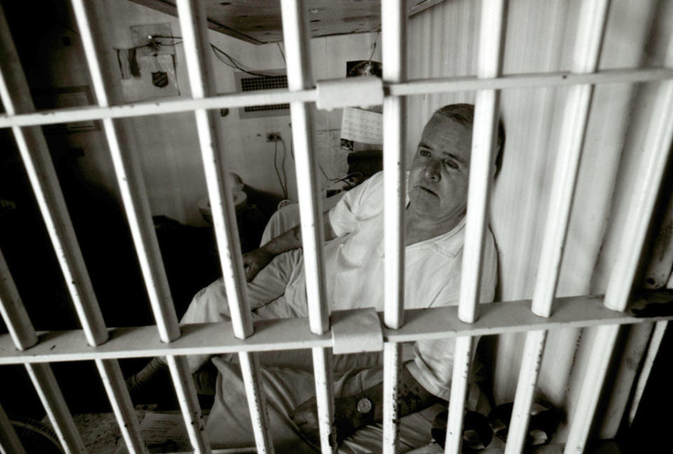 Henry Lee Lucas sitting in his prison cell