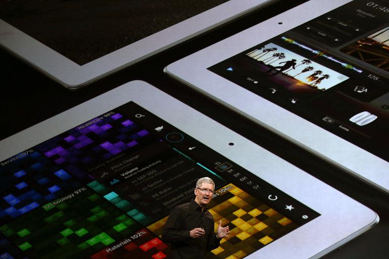 Apple CEO Tim Cook presents iPad Air, a new iPad mini with Retina display, at the Yerba Buena Center for the Arts in San Francisco, California, on October 22, 2013