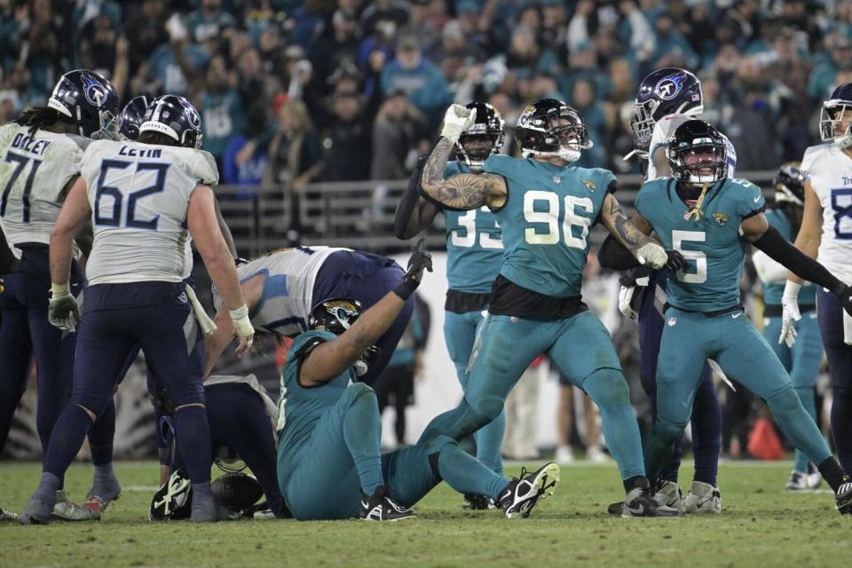 Jaguars defensive end Adam Gotsis pumps his arm in the air after recording a sack against the Titans